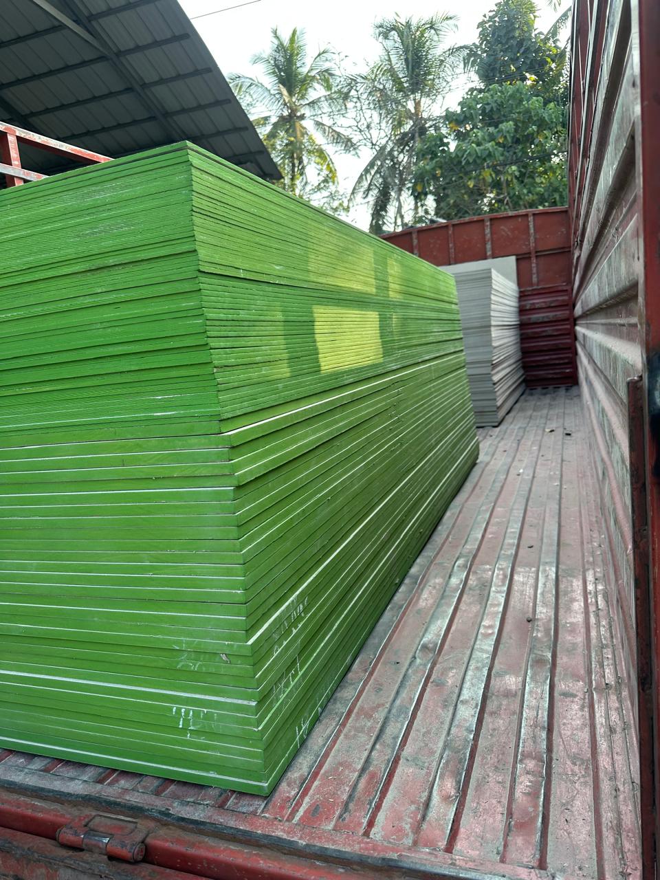 Stack of cement fibre board flat sheets supplied in Kerala